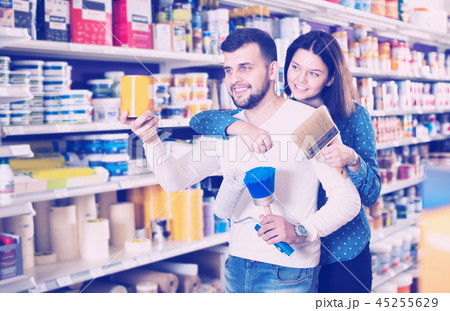 Couple choosing house decoration materials 45255629