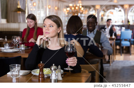 Thoughtful girl in restaurant Thoughtful girl in restaurant 45255647