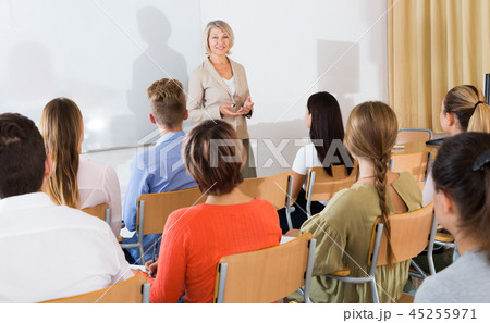 Students listening to lecture of female teacher Students listening to lecture of female teacher 45255971