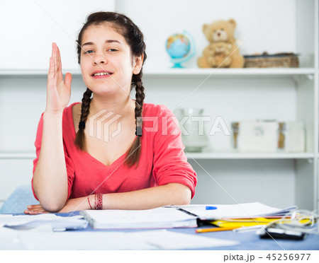 Girl doing homework 45256977