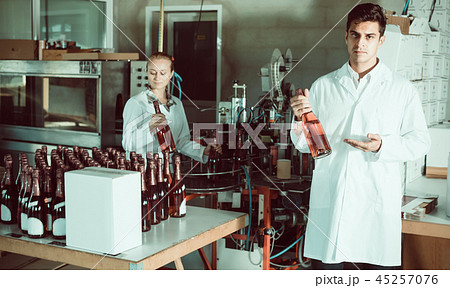 man and woman working on wine production 45257076