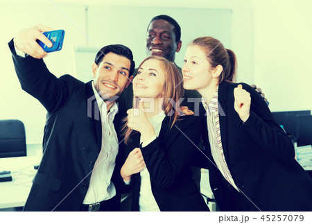 Happy business people making selfie Happy business people making selfie 45257079