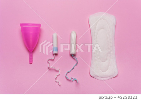 Pad, menstrual cup, tampon on a pink background. Pad, menstrual cup, tampon on a pink background. 45258323