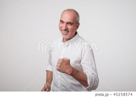 mature handsome business man with fist. mature handsome business man with fist. 45258574