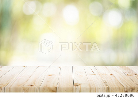 Empty table for present product with green bokeh. 45259696