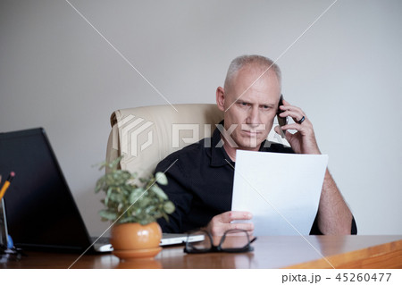 Businessman Working  With Papers 45260477