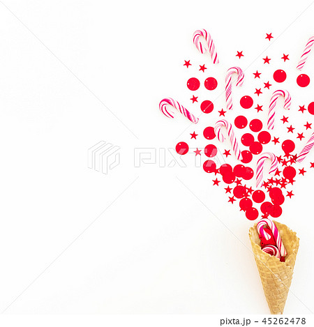 Christmas concept with red confetti, candy canes Christmas concept with red confetti, candy canes 45262478