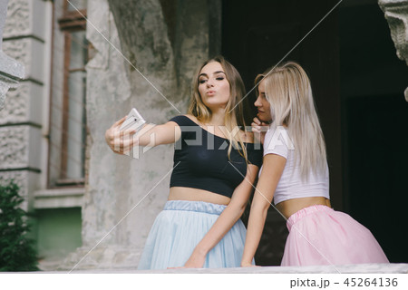 Girls with phone 45264136