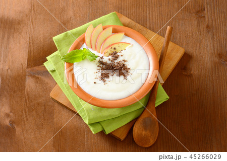 Semolina or rice pudding with apple and chocolate 45266029