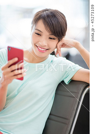 woman use phone happily 45273109
