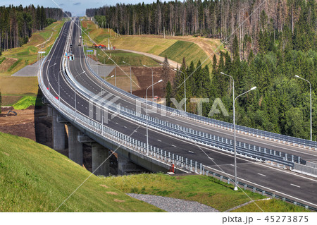 Top view of highway crossing forest, and bridge Top view of highway crossing forest, and bridge 45273875