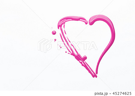 Nail polish on a white background in the form of a pink heart 45274625