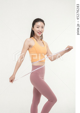 A Korean woman with a waist on a tape measure 45276283