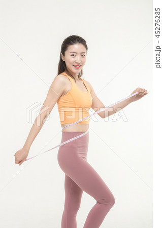 A Korean woman with a waist on a tape measure 45276285
