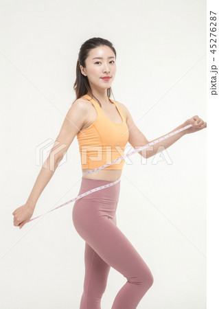 A Korean woman with a waist on a tape measure 45276287