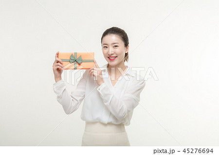 A woman who is delighted to receive a gift 45276694