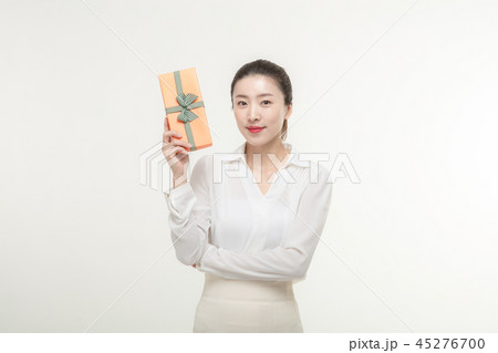 A woman who is delighted to receive a gift A woman who is delighted to receive a gift 45276700