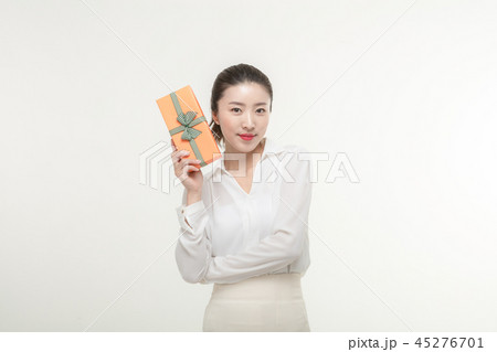 A woman who is delighted to receive a gift A woman who is delighted to receive a gift 45276701