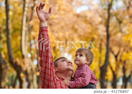 Happy family and children are in autumn city park Happy family and children are in autumn city park 45276897