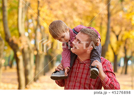 Happy family and children are in autumn city park Happy family and children are in autumn city park 45276898