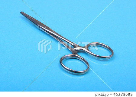Close Up Surgical instruments and tools on blue mirror background. Selective focus. Close Up Surgical instruments and tools on blue mirror background. Selective focus. 45278095