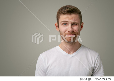 A nervous doubtful male frowning eyebrow A nervous doubtful male frowning eyebrow 45279379