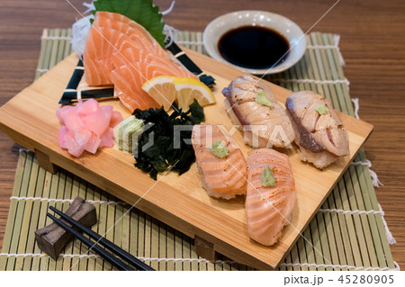 Mixed salmon sushi on wooden plate 45280905