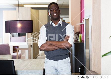Portrait of seller man who is offering new furniture 45284723