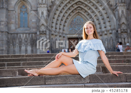Girl sitting on stairs of temple 45285178