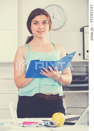 Manager is signing agreement papers of financial nature 45285347