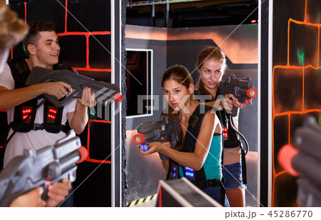 Happy Laser tag players playing in teams 45286770