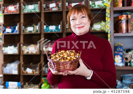female buyer buying sweet candies female buyer buying sweet candies 45287398