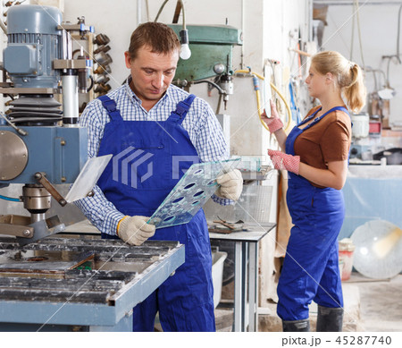 Craftsman working on glass drilling machine Craftsman working on glass drilling machine 45287740