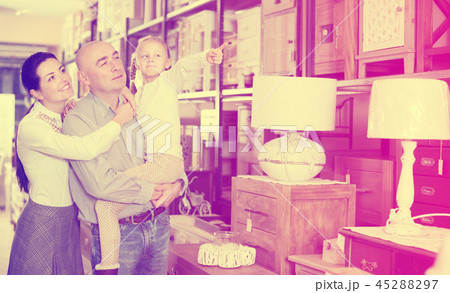 Family is choosing new furniture Family is choosing new furniture 45288297