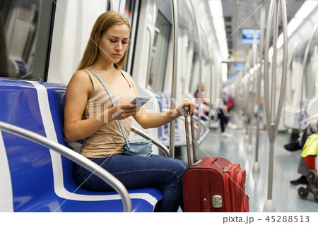 Woman using phone inside subway 45288513