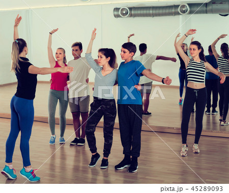 friendly teens studying folk style dance 45289093