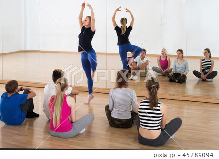 Woman dance teacher demonstrates ballet position Woman dance teacher demonstrates ballet position 45289094