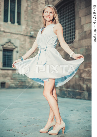 Positive female walking at the street 45289748