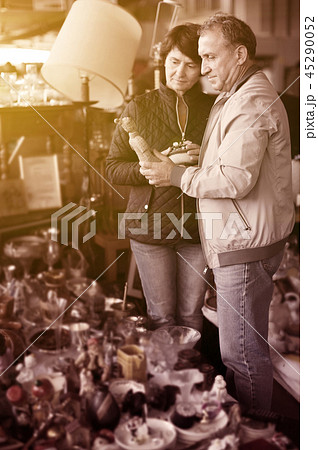 Senior man and female at traditional flea market 45290052