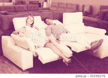 Couple who are choosing new sofa-transformer Couple who are choosing new sofa-transformer 45290276