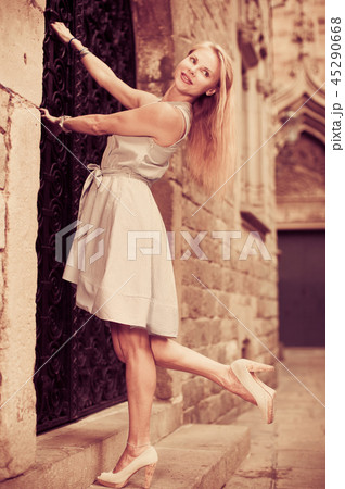 adult glad woman near the door adult glad woman near the door 45290668