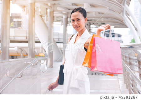 Happy woman with shopping bags enjoying in shop Happy woman with shopping bags enjoying in shop 45291267
