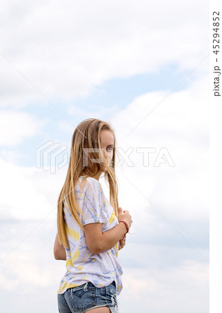 young girl on a background of clouds 45294852