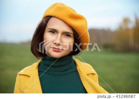 Fashionable women in bright yellow beret  45296087