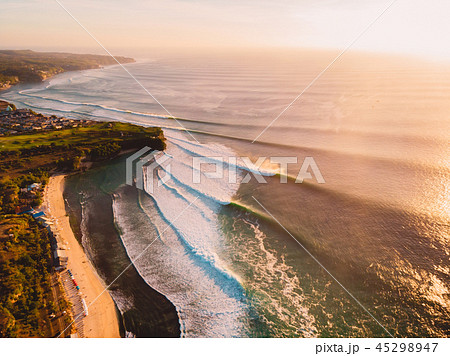 Aerial view of waves at warm sunset and beach Aerial view of waves at warm sunset and beach 45298947