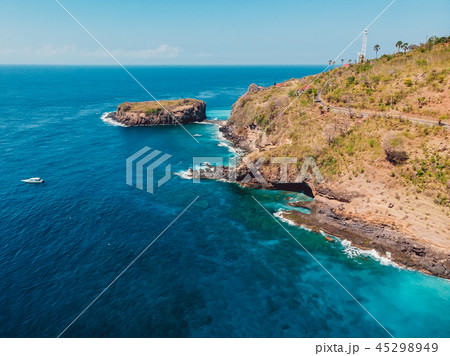 Blue ocean with rocky coast and island Blue ocean with rocky coast and island 45298949