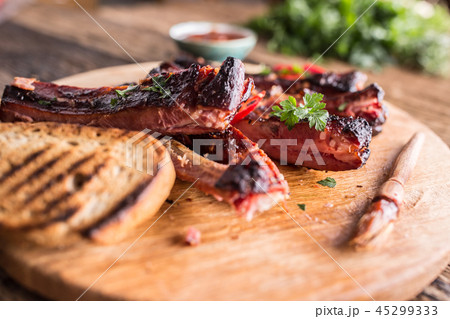 Carbecue grilled pork ribs with chili pepers. 45299333