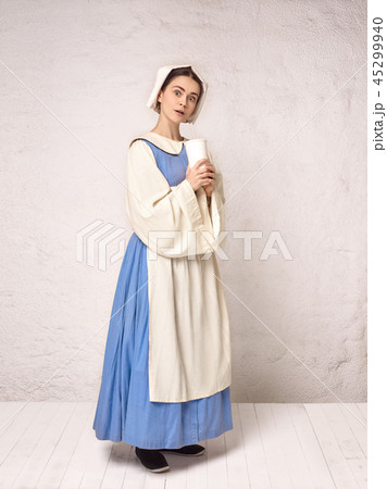 Medieval Woman in Historical Costume Wearing Corset Dress and Bonnet. 45299940