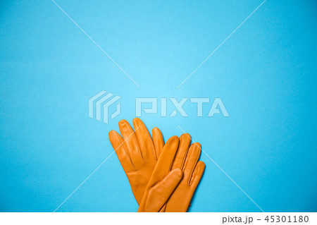 yellow gloves on a blue background, copy space yellow gloves on a blue background, copy space 45301180