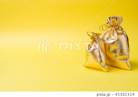 Christmas new year concept. Golden gift bag Christmas new year concept. Golden gift bag 45302314